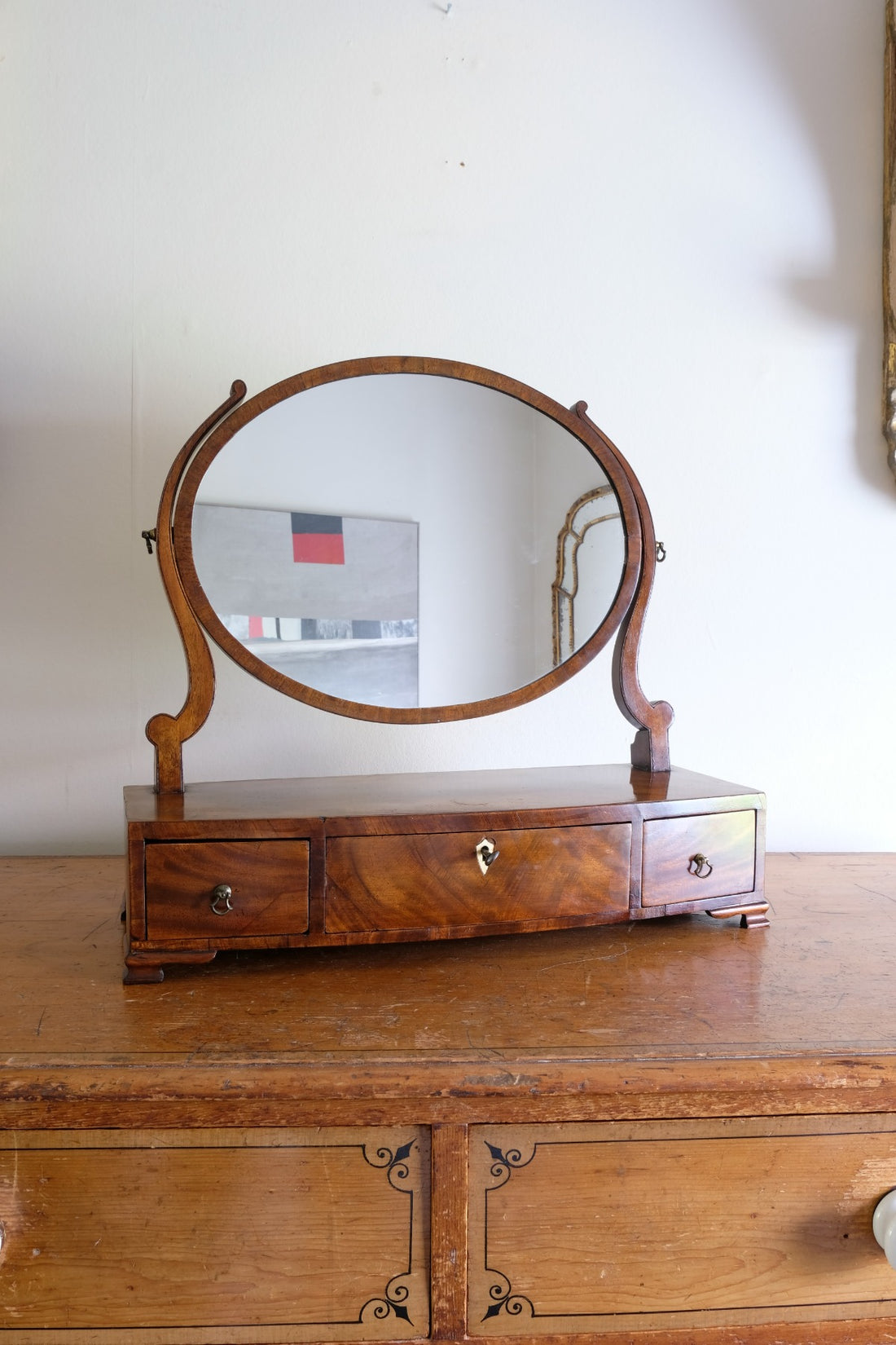 Flamed Mahogany Table Top Oval Mirror With Three Bow Fronted Drawers