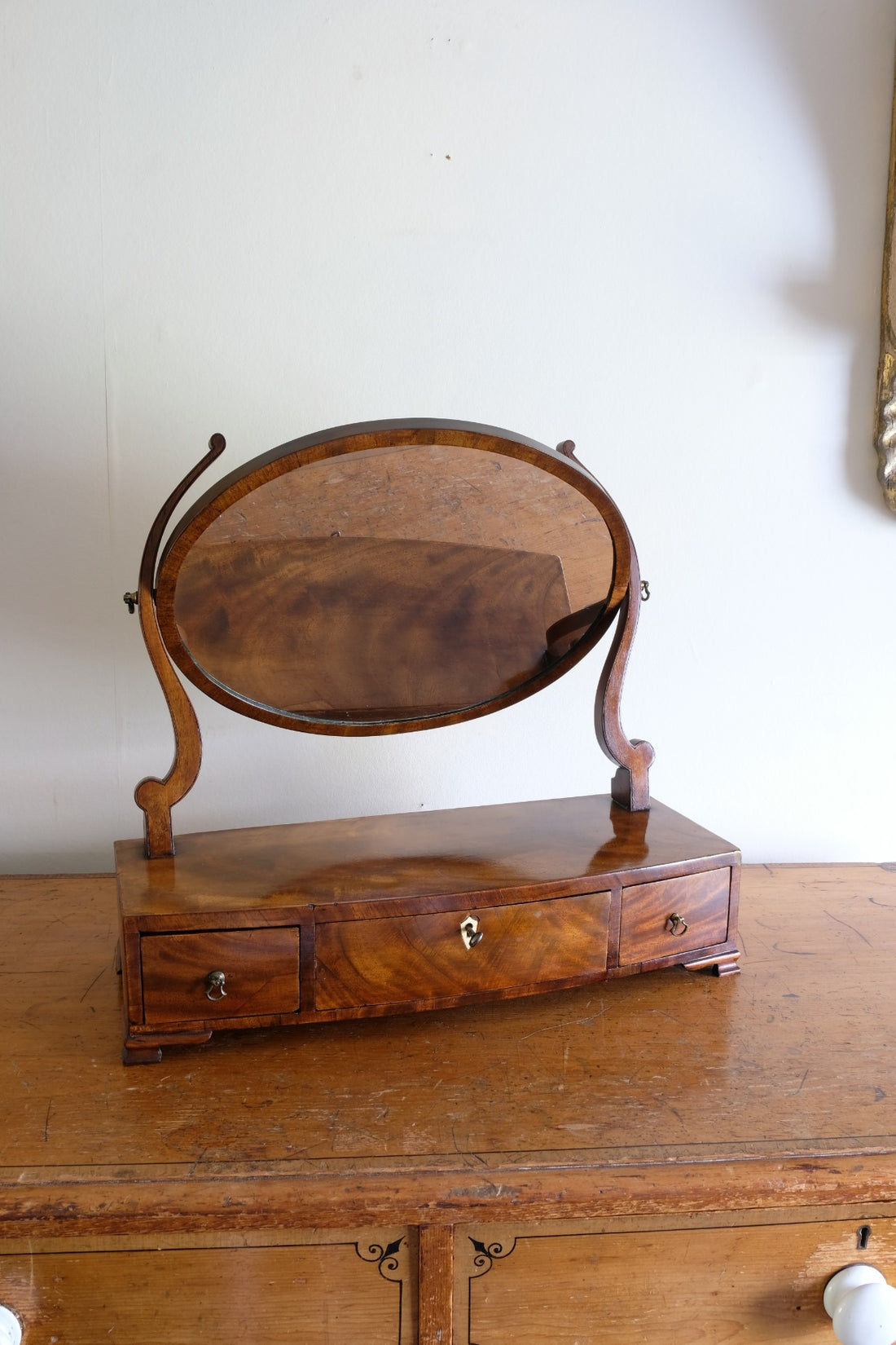 Flamed Mahogany Table Top Oval Mirror With Three Bow Fronted Drawers