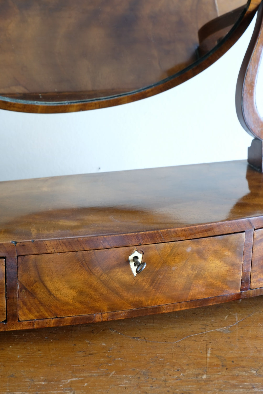Flamed Mahogany Table Top Oval Mirror With Three Bow Fronted Drawers