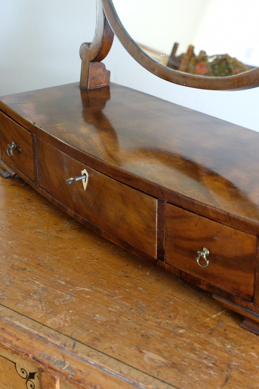 Flamed Mahogany Table Top Oval Mirror With Three Bow Fronted Drawers