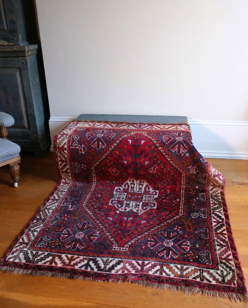 Middle Eastern Wool Rug With A Red Ground With Animals and Floral Motifs