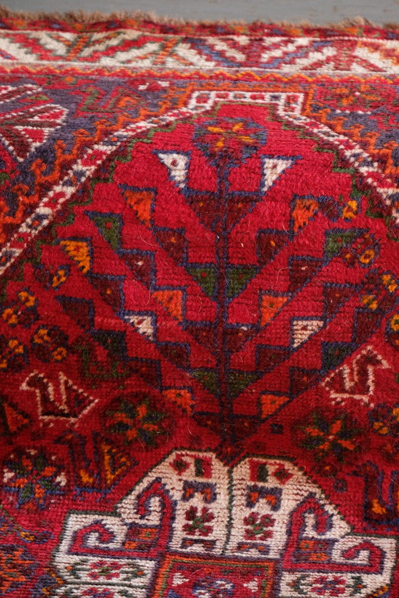Middle Eastern Wool Rug With A Red Ground With Animals and Floral Motifs