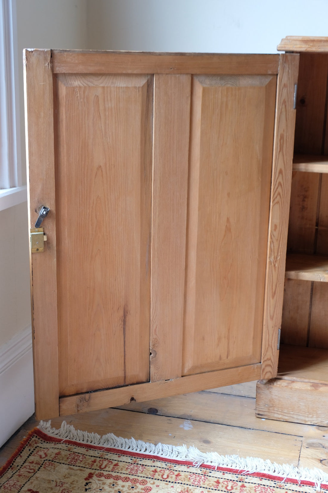 Interior plank construction of Victorian pine storage cupboard