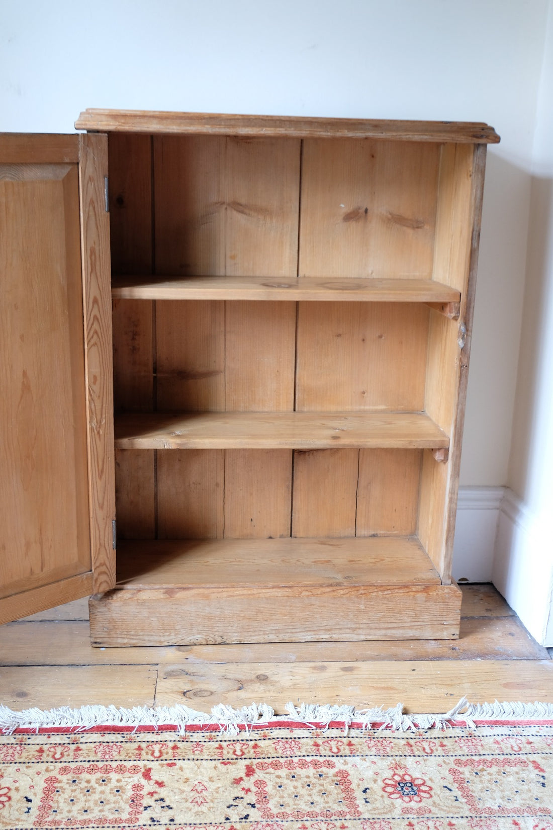 Interior plank construction of Victorian pine storage cupboard