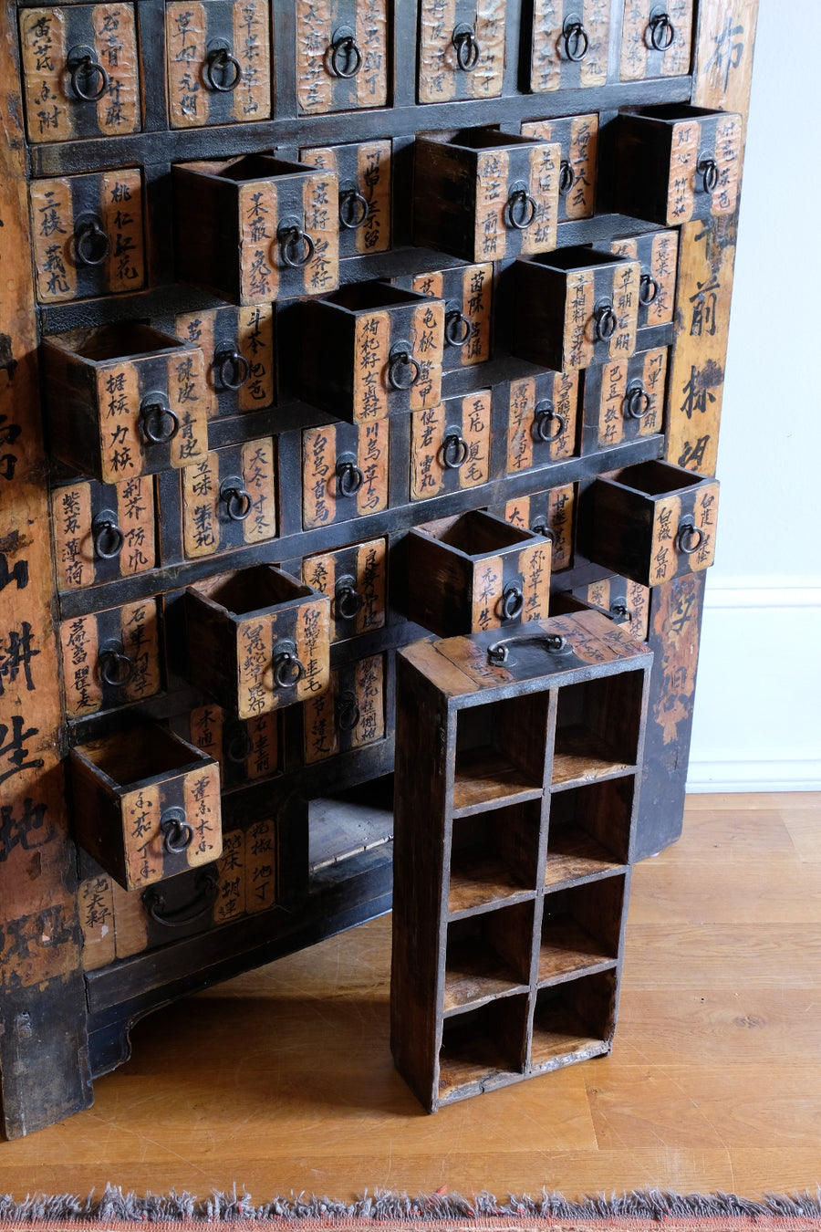 Ornate fretwork skirting on early 1900s Chinese bank of drawers