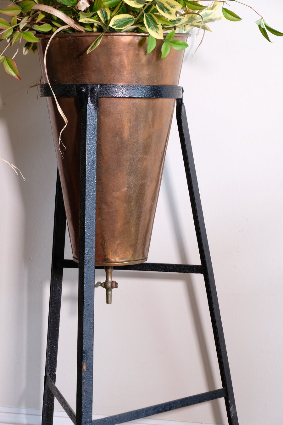 Large Victorian copper conical planter on cast iron stand