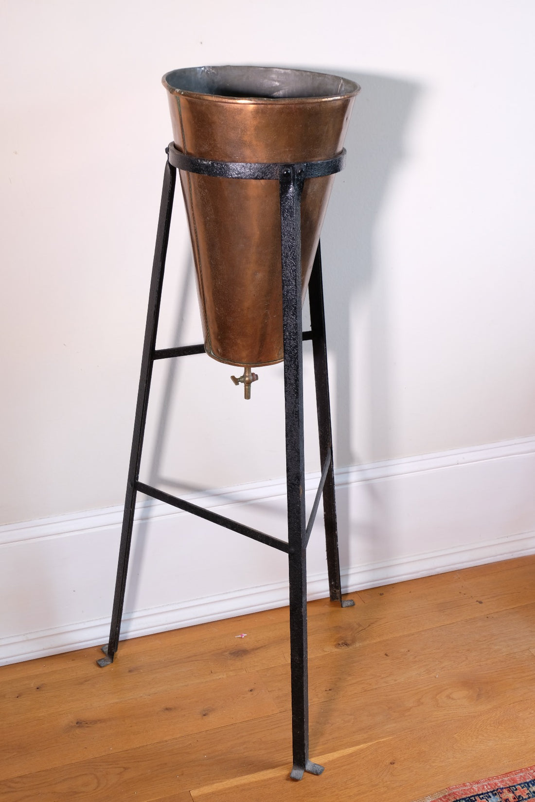 Large Victorian copper conical planter on cast iron stand