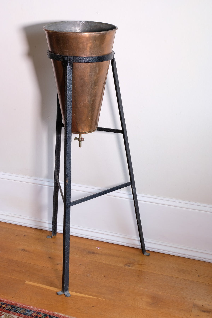 Large Victorian copper conical planter on cast iron stand