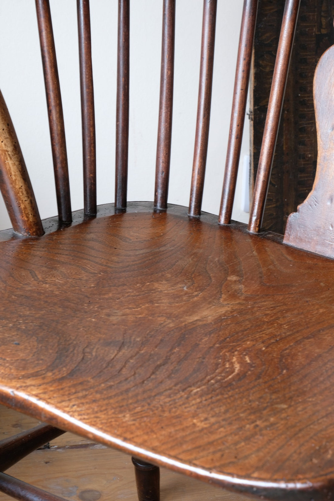 saddle seat of a 19th Century Windsor Wheelback Armchair in Ash & Elm