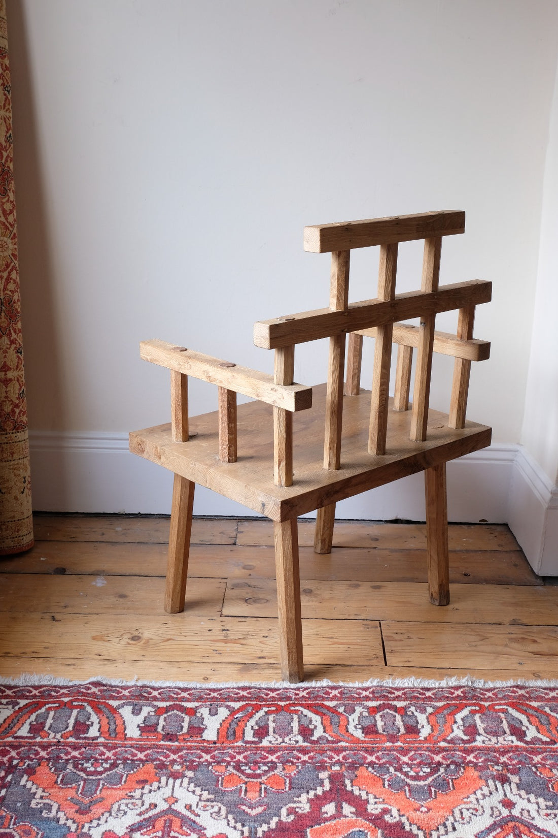 back view - Primitive handmade wooden armchair with rustic timber finish and blocky carved design