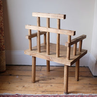 back view - Primitive handmade wooden armchair with rustic timber finish and blocky carved design
