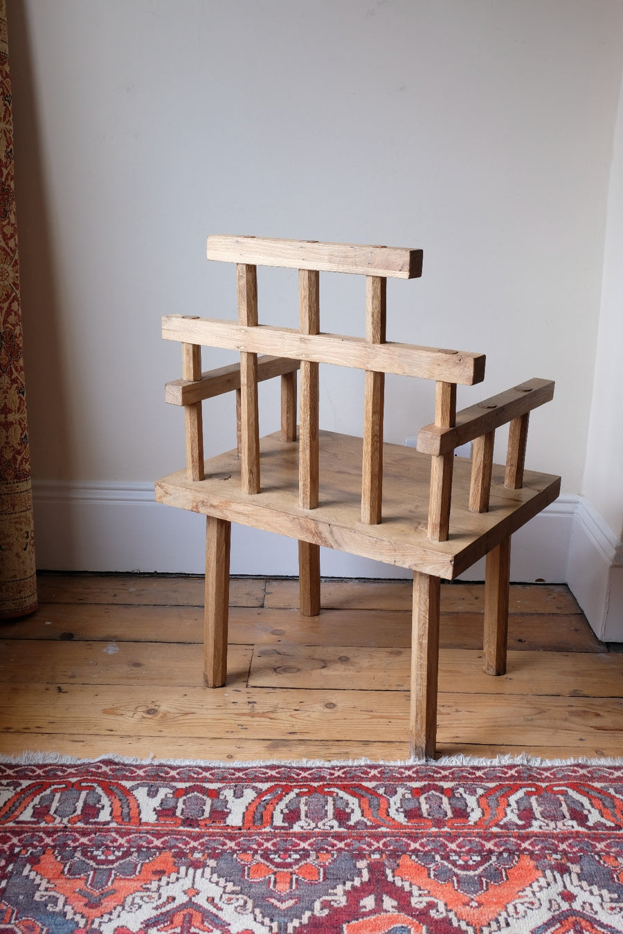 back view - Primitive handmade wooden armchair with rustic timber finish and blocky carved design