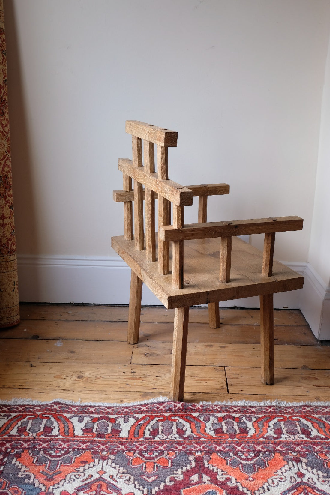 back view - Primitive handmade wooden armchair with rustic timber finish and blocky carved design