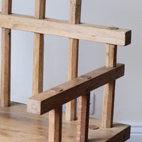 Close up arm - Primitive handmade wooden armchair with rustic timber finish and blocky carved design