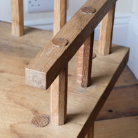 Close up arm - Primitive handmade wooden armchair with rustic timber finish and blocky carved design