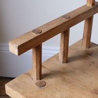 Close up armrest - Primitive handmade wooden armchair with rustic timber finish and blocky carved design