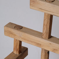 Close up back - Primitive handmade wooden armchair with rustic timber finish and blocky carved design