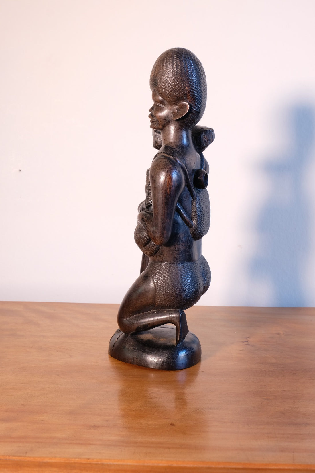 Kenyan ebony wood carving kneeling mother with child bundle