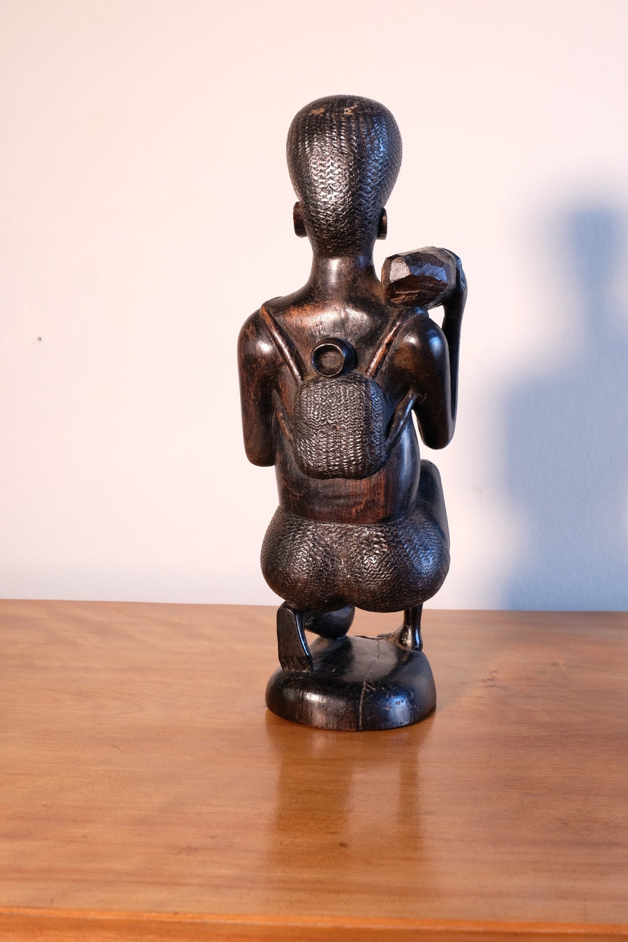 Kenyan ebony wood carving kneeling mother with child bundle