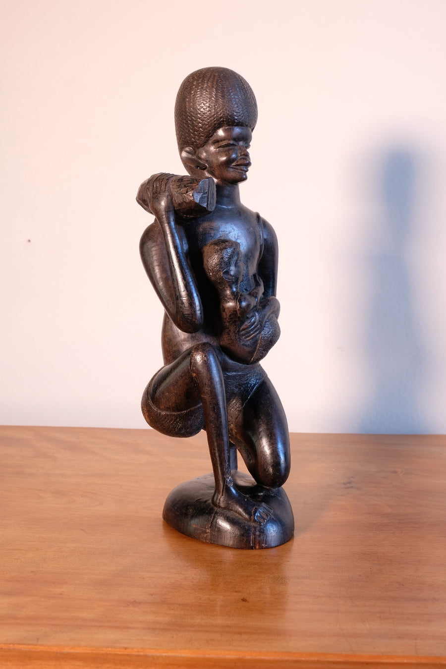 Kenyan ebony wood carving kneeling mother with child bundle