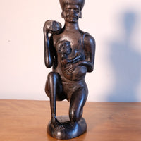 Kenyan ebony wood carving kneeling mother with child bundle