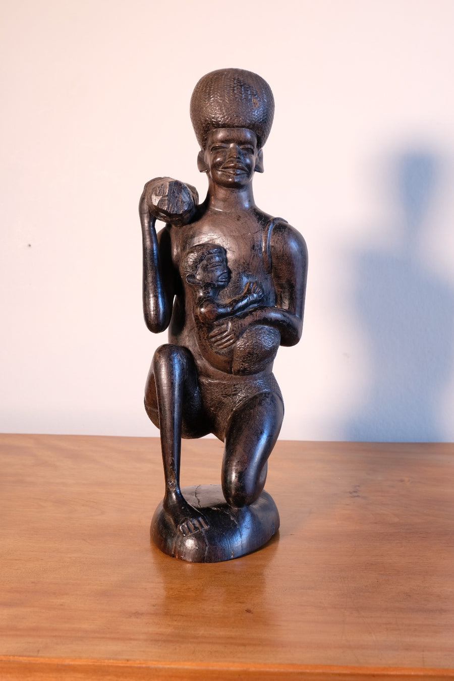 Kenyan ebony wood carving kneeling mother with child bundle