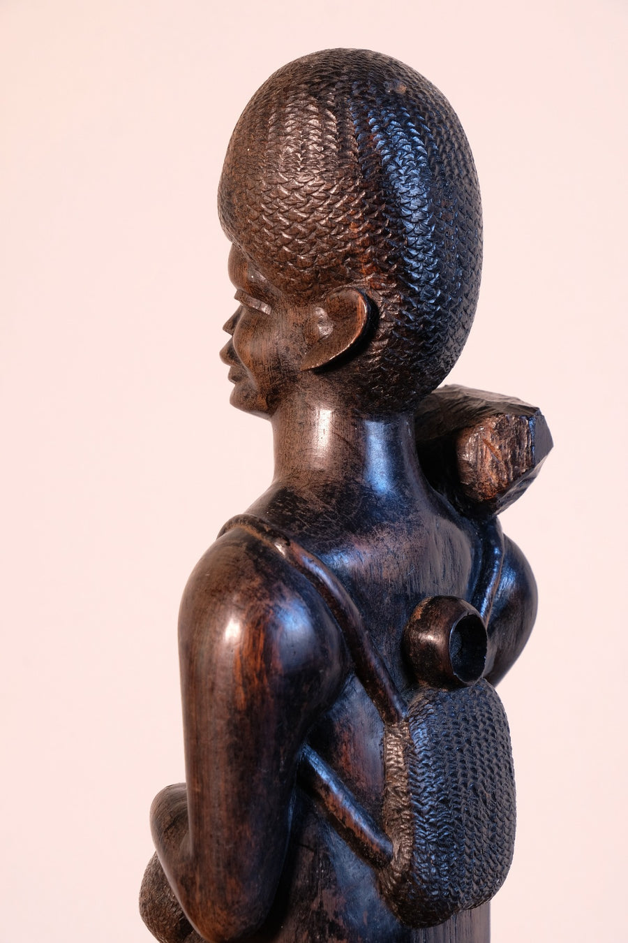 Close up of the back of the Mid century Kenyan/Tanzanian ebony figure dense black wood