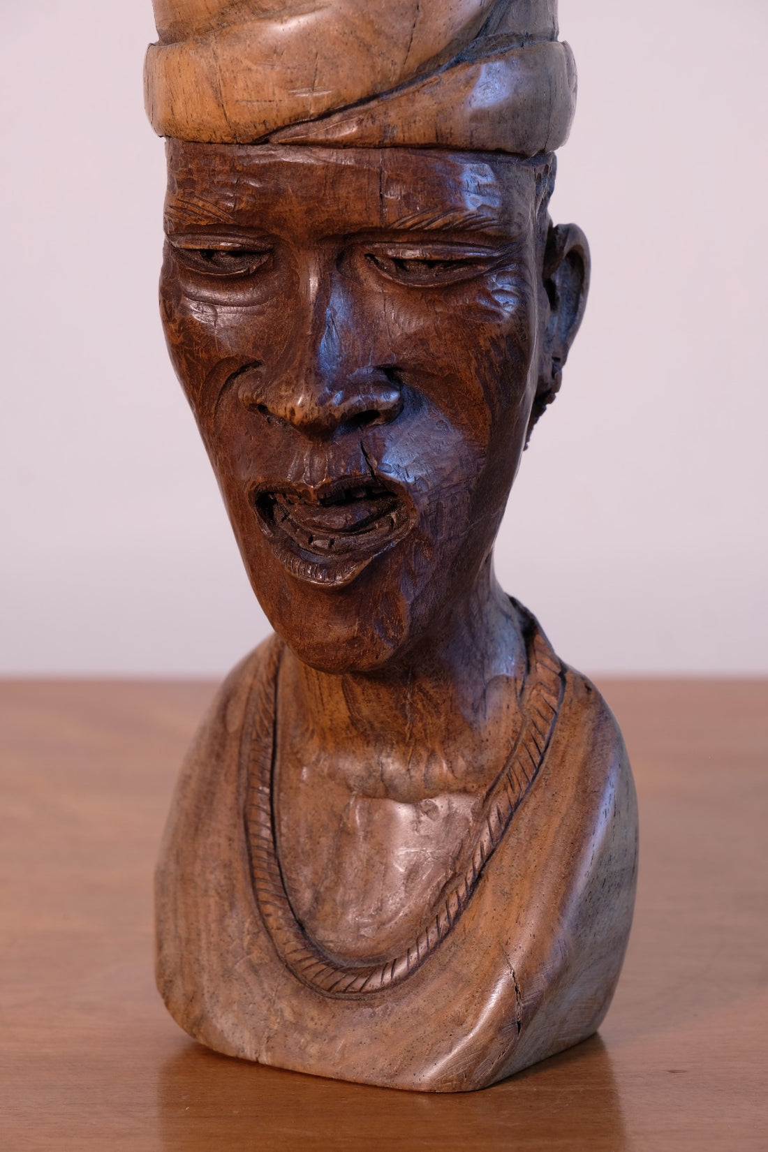close up of a African Hand-Carved Wooden Bust Sculpture – Vintage Tribal Portrait Art (24.5cm)