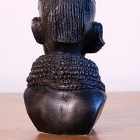 sculpture with textured beaded neck adornment