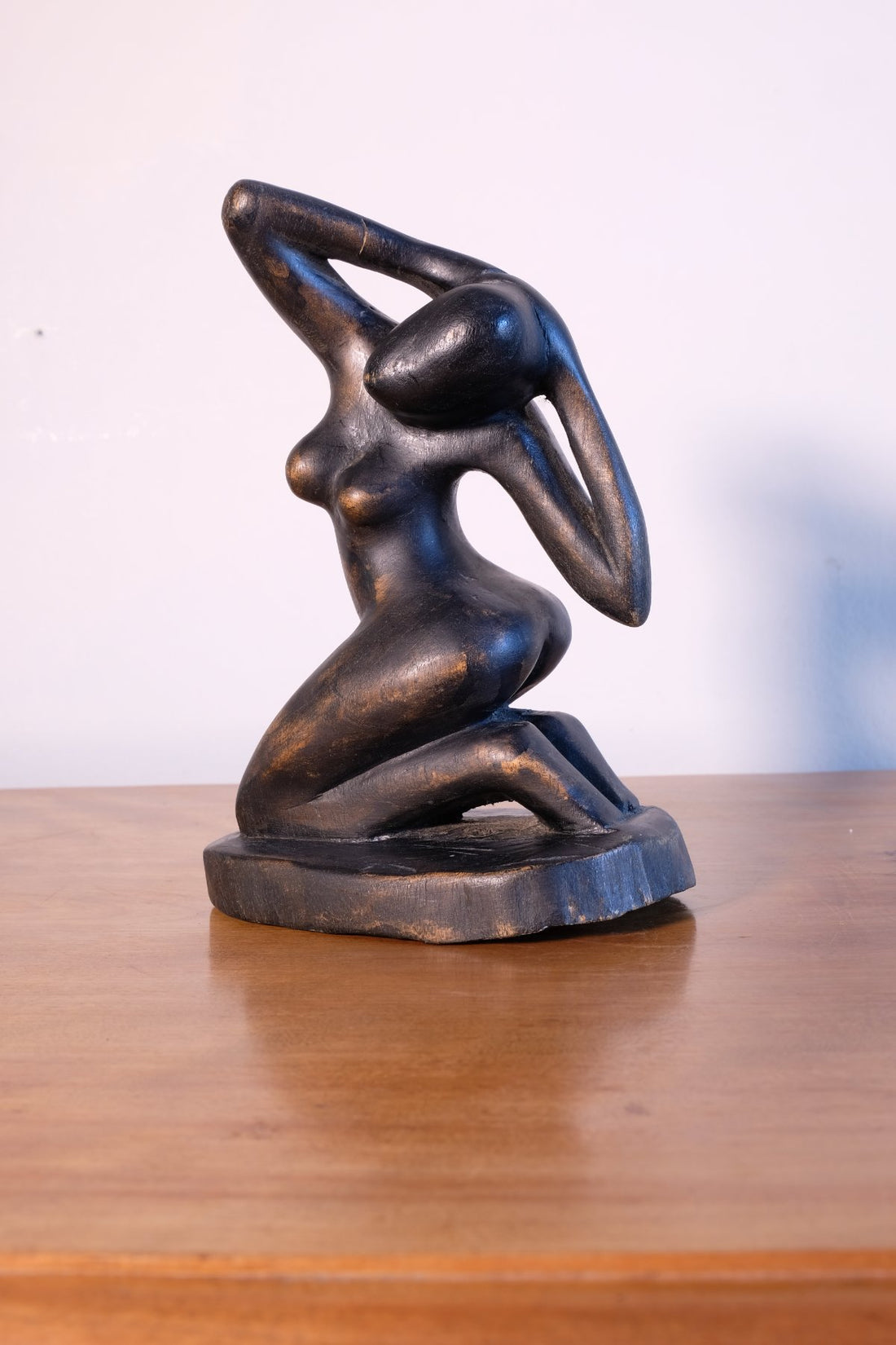 Mid century modernist carved wooden kneeling female nude sculpture with ebonised finish