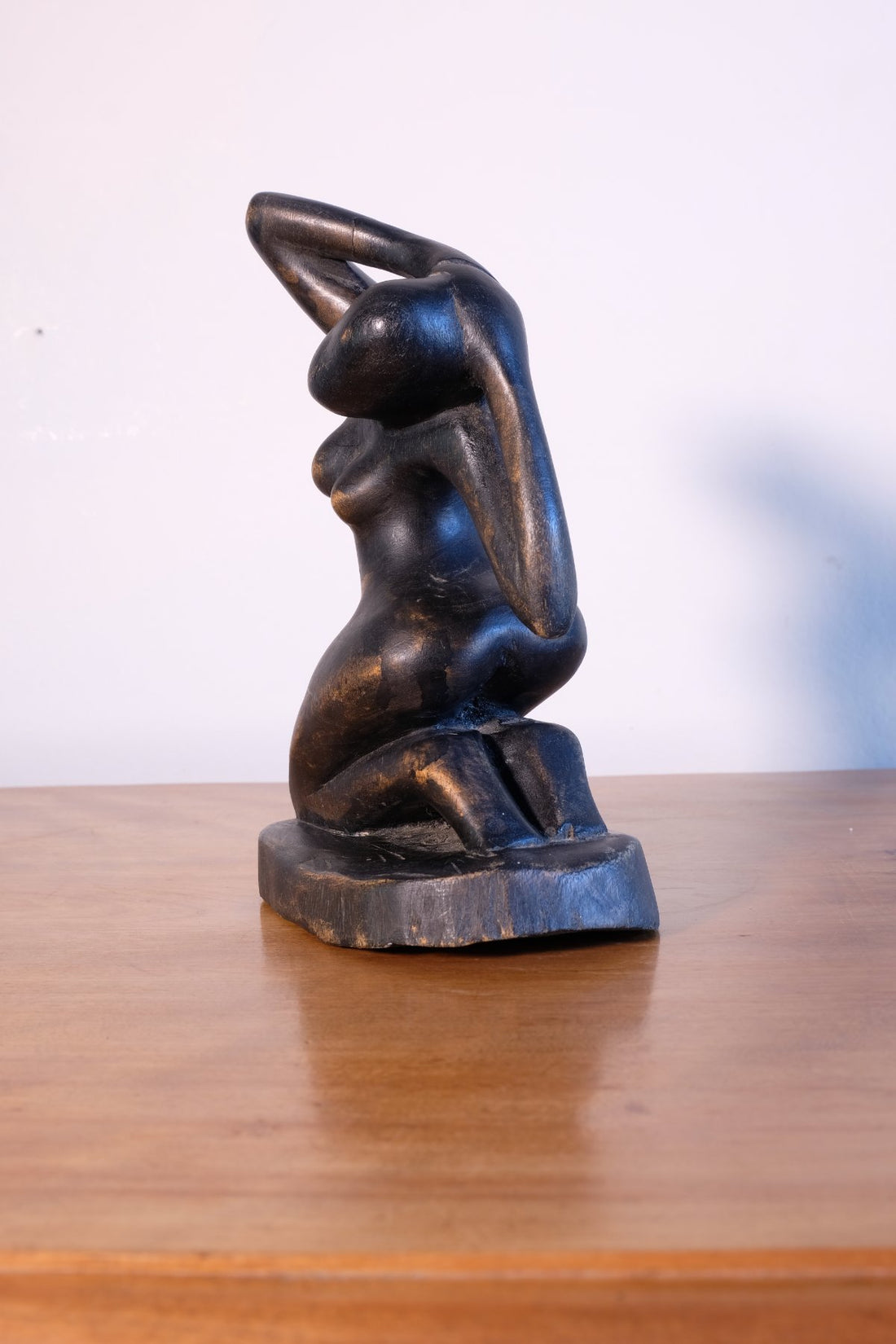 Mid century modernist carved wooden kneeling female nude sculpture with ebonised finish