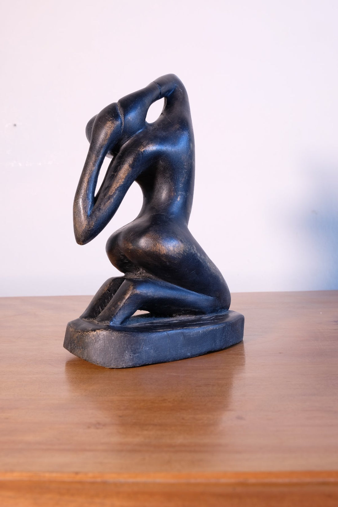 Mid century modernist carved wooden kneeling female nude sculpture with ebonised finish