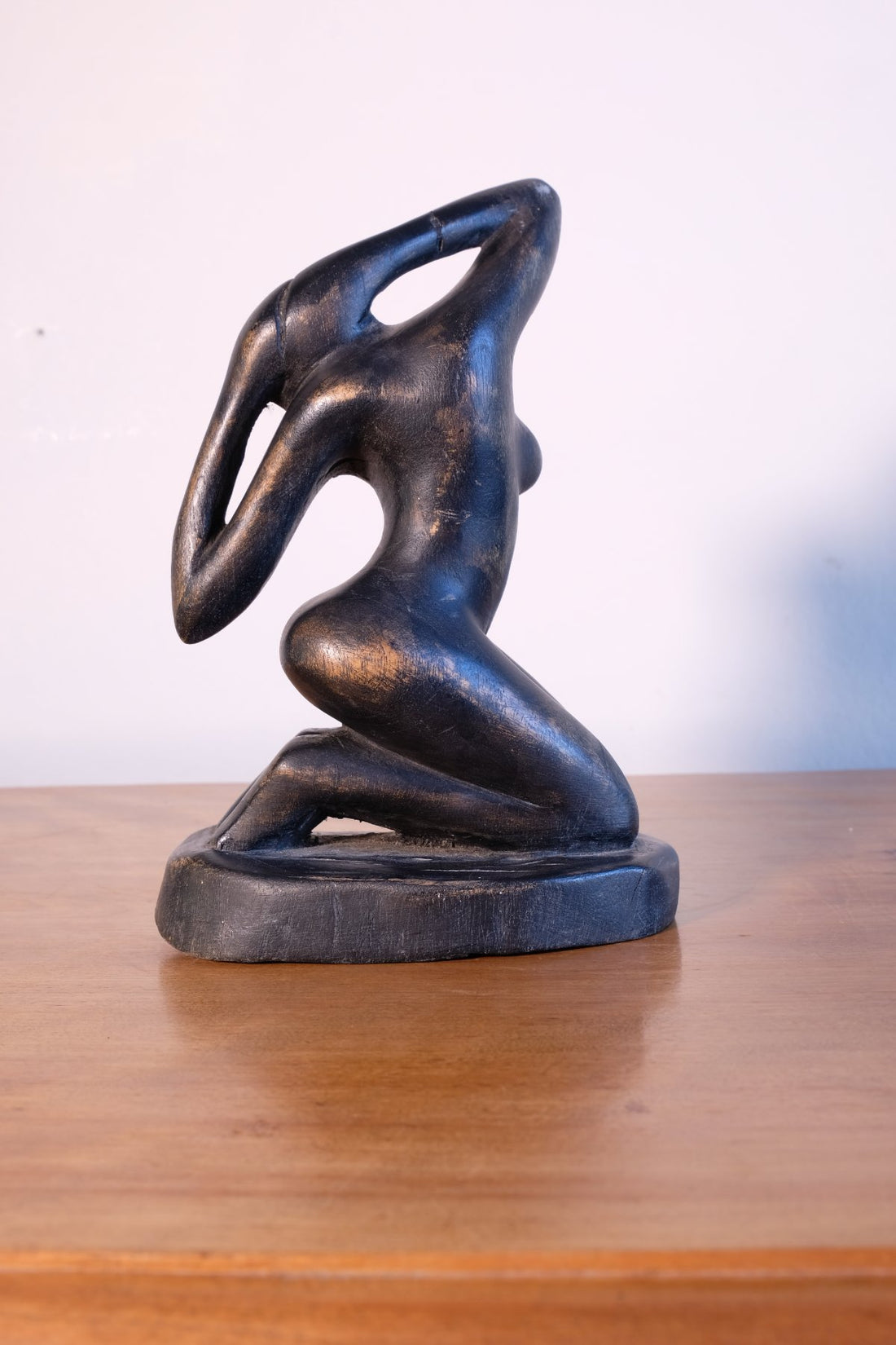 Mid century modernist carved wooden kneeling female nude sculpture with ebonised finish