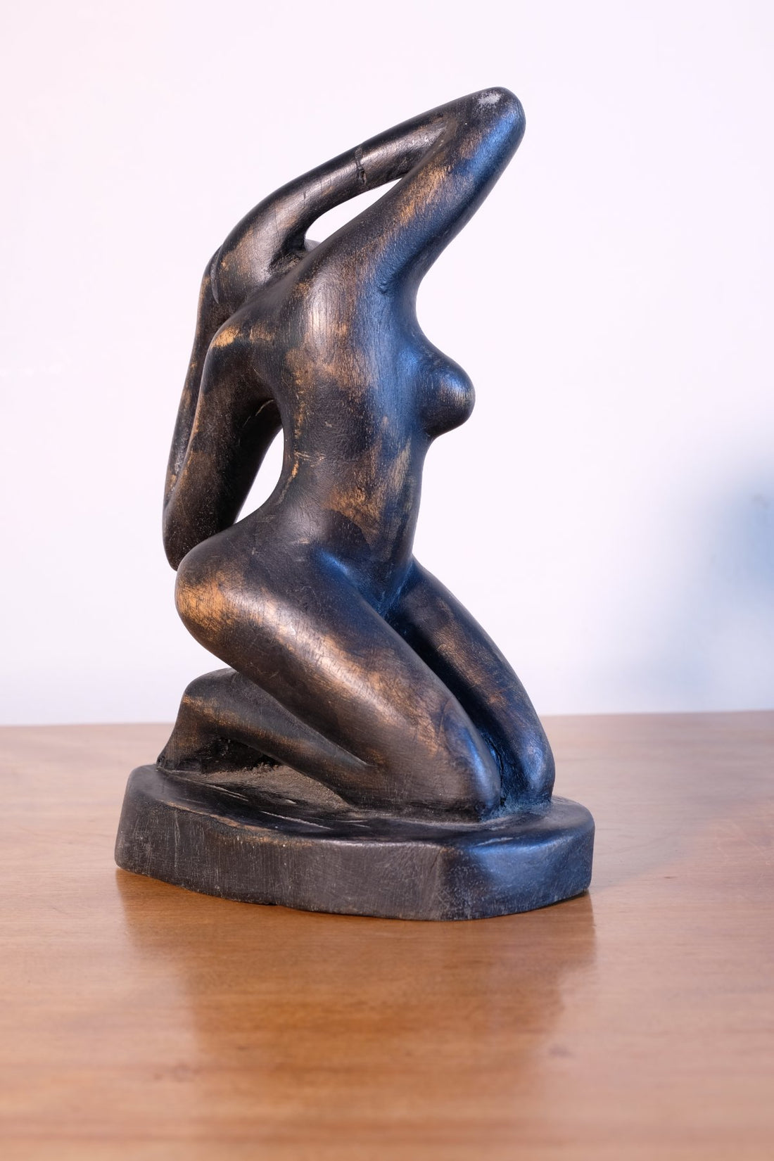 Mid century modernist carved wooden kneeling female nude sculpture with ebonised finish