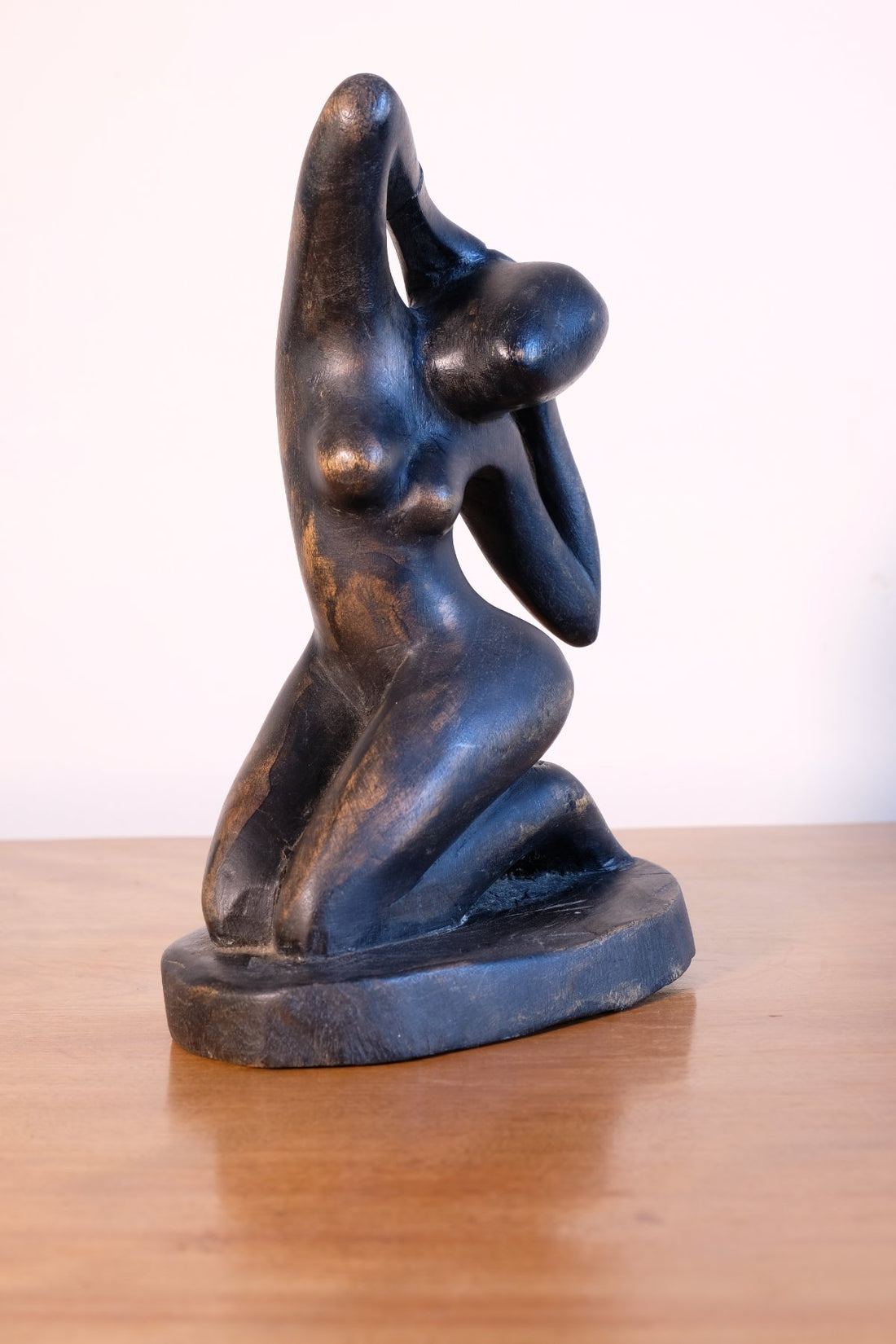 Mid century modernist carved wooden kneeling female nude sculpture with ebonised finish