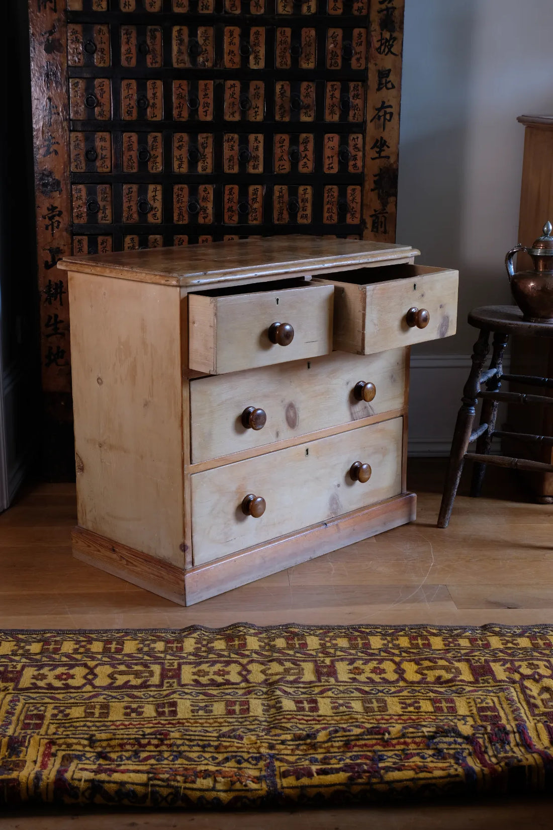 Top drawers open on a Victorian Pine Chest of Drawers – Two Small Over Two Deep
