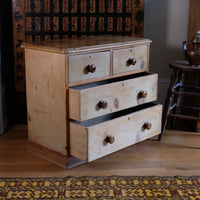 Bottom two drawers open on a Victorian Pine Chest of Drawers – Two Small Over Two Deep