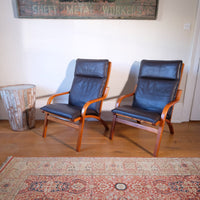 Pair of 1970s Danish Stouby bentwood leather lounge chairs with sculptural oak frames