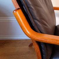 wood detail of a Cushion support of a Pair of 1970s Danish Stouby bentwood leather lounge chairs with sculptural oak frame