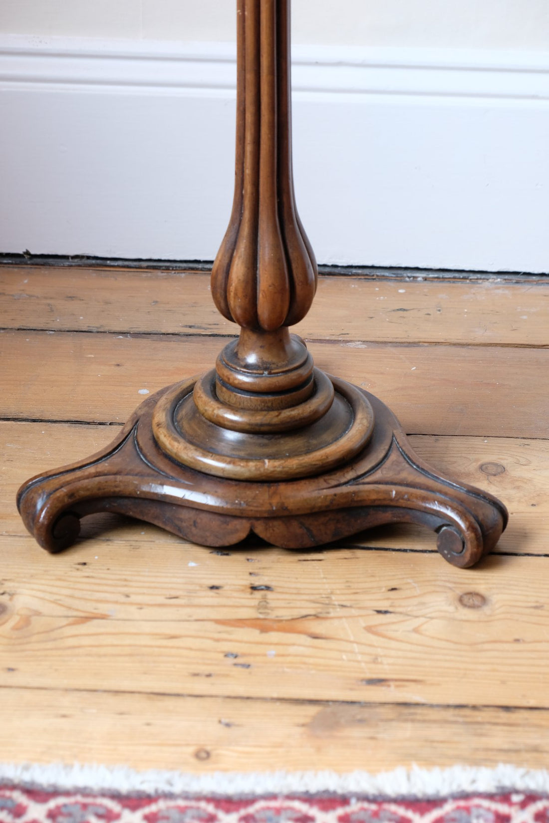 English Regency solid walnut candlestand table with burr walnut top and tulip-shaped sconce