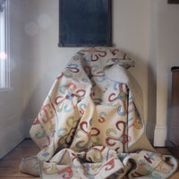 Vintage Uzbek Suzani kilim rug with embroidered floral medallions and vine scroll border, 173 x 230cm