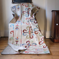 Vintage Uzbek Suzani kilim rug with embroidered floral medallions and vine scroll border, 173 x 230cm