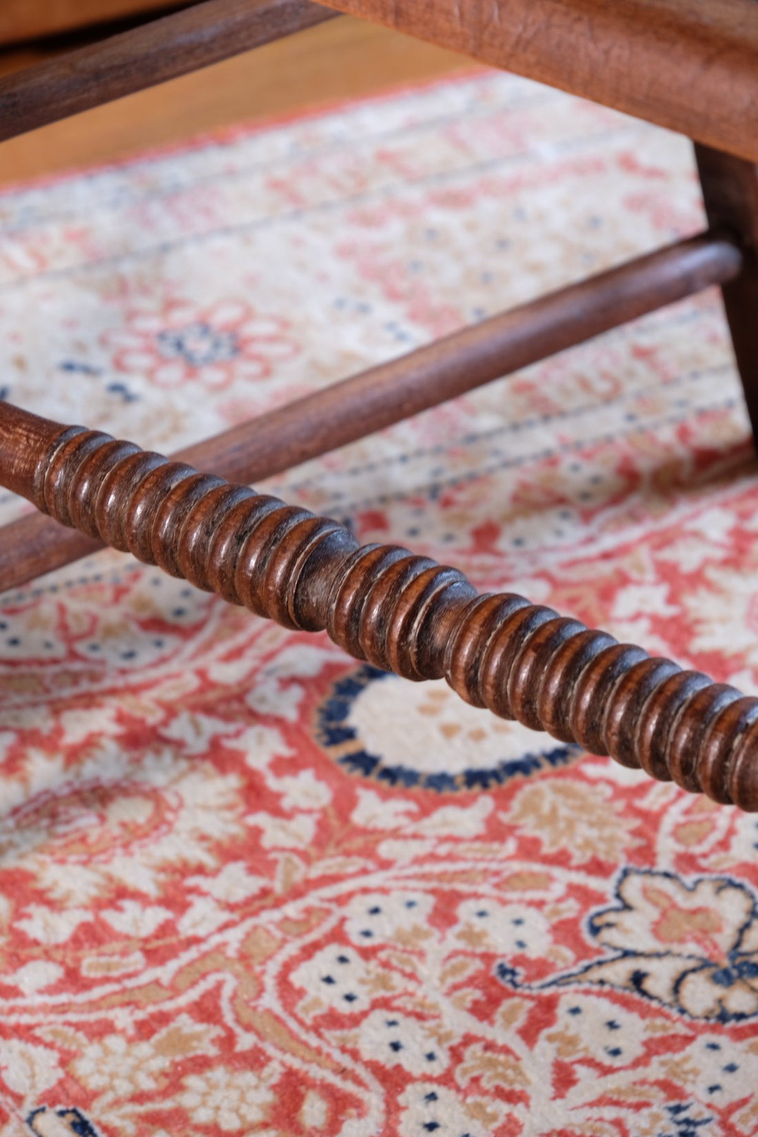 Bobbin stretcher on a Pair of Regency mahogany armchairs with brass inlay and cane seats, circa 1810