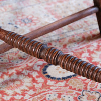 Bobbin stretcher on a Pair of Regency mahogany armchairs with brass inlay and cane seats, circa 1810