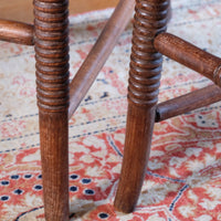 Bobbin legs on a Pair of Regency mahogany armchairs with brass inlay and cane seats, circa 1810