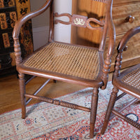 cane seat on a Bobbin stretcher on a Pair of Regency mahogany armchairs with brass inlay and cane seats, circa 1810
