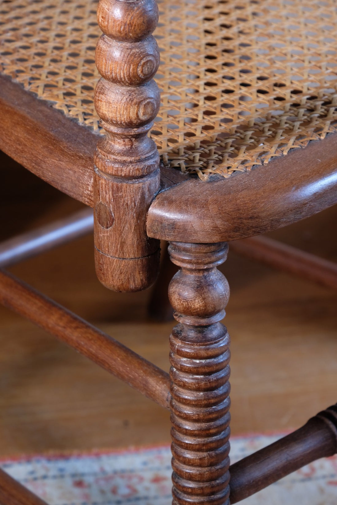 seat joint on a Pair of Regency mahogany armchairs with brass inlay and cane seats, circa 1810
