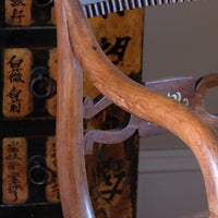 curved arm on a Pair of Regency mahogany armchairs with brass inlay and cane seats, circa 1810