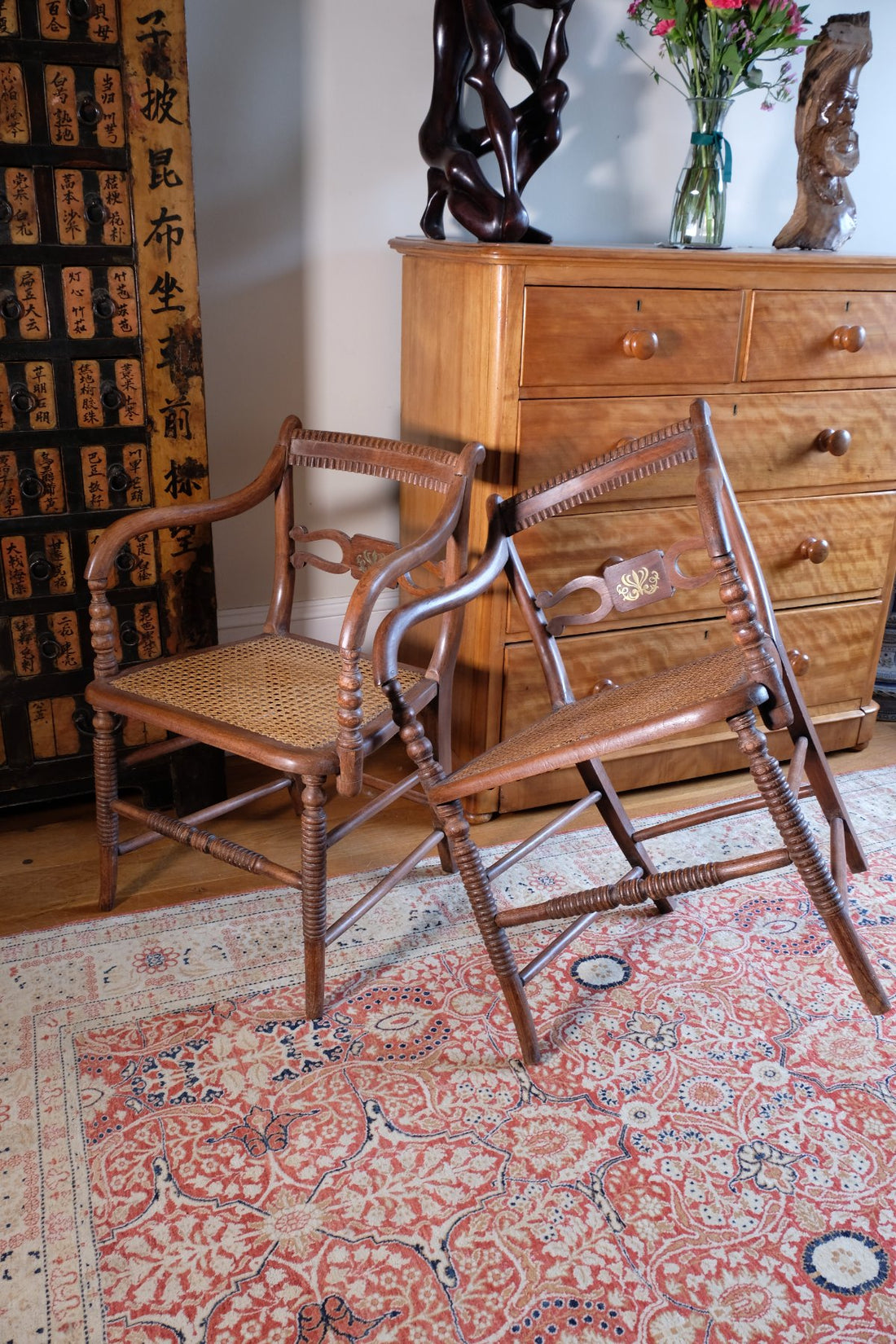 Pair of Regency mahogany armchairs with brass inlay and cane seats, circa 1810