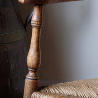 Close up turned arm supports on the Philip Clissett Arts & Crafts Ash Rush Seat Spindle Back Armchair Circa 1890Philip Clissett Arts & Crafts Ash Rush Seat Spindle Back Armchair Circa 1890